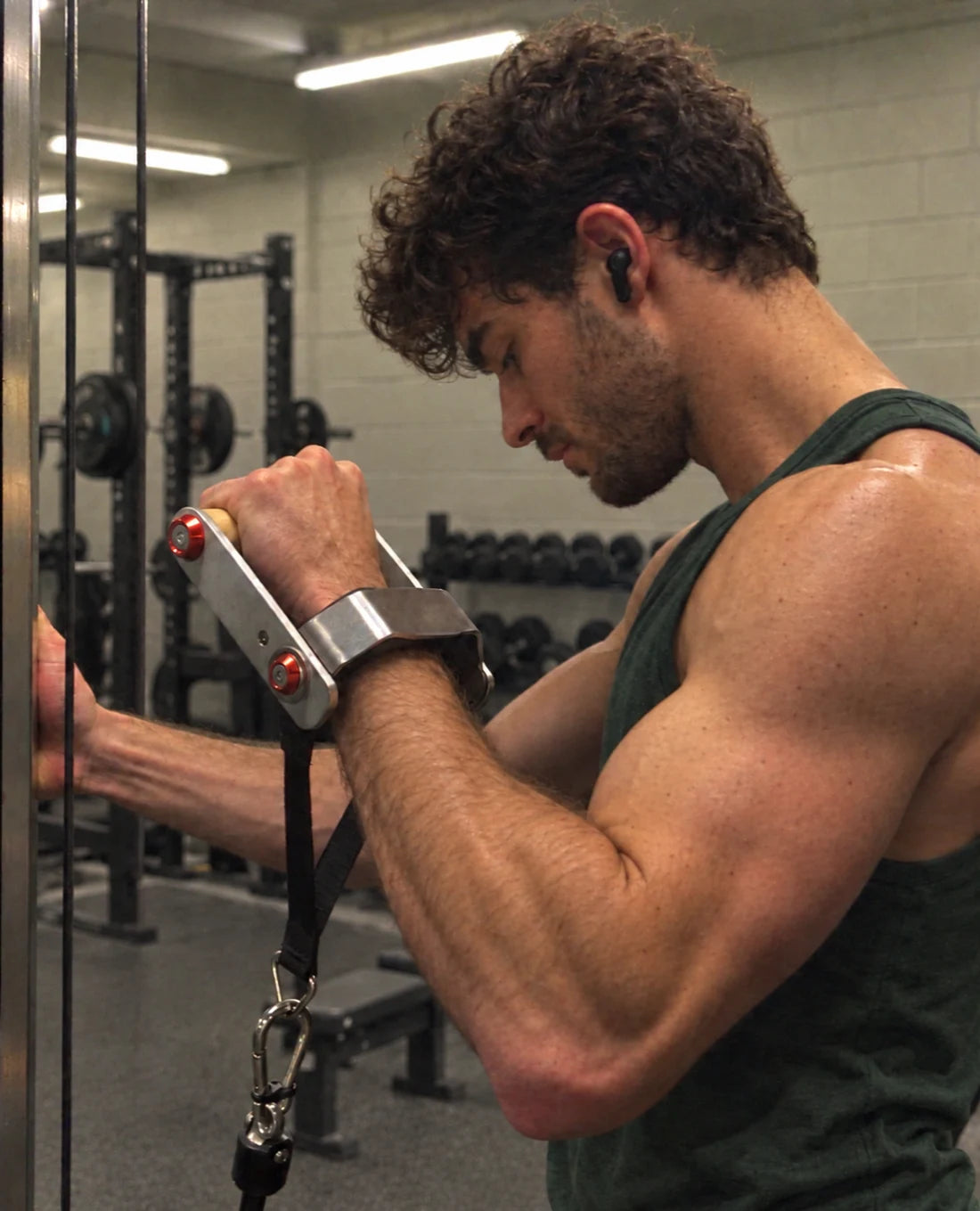 Athlete using the wrist-support cable cuff in a gym